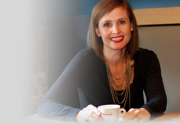 Clare McCormack Superfino Clare McCormack sitting at a table with a coffee cup